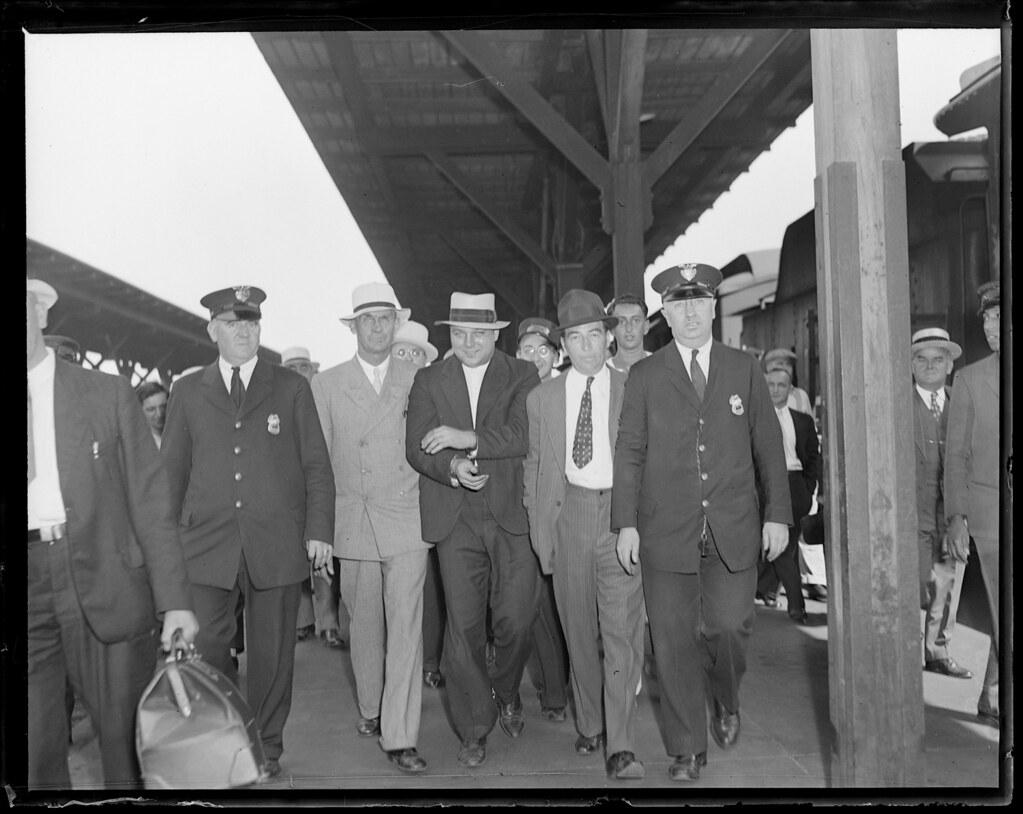 Theodore Bentz, Dillinger gang member, brought through Boston train station on his way to Michigan after capture in Portland