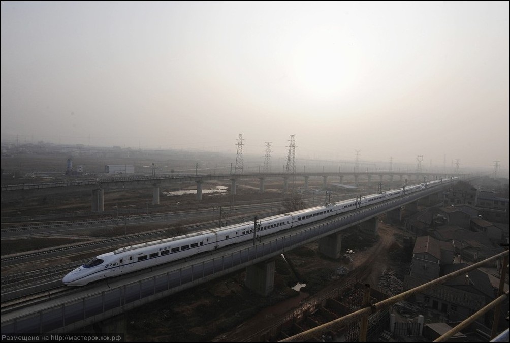 A high-speed train travels on the new Wuhan-Guangzhou railway in Wuhan