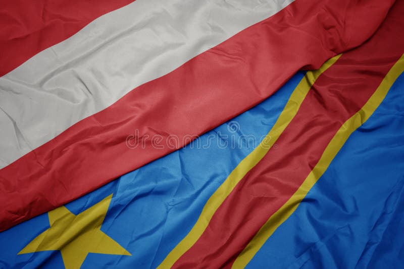 Waving colorful flag of democratic republic of the congo and national flag of austria. Macro royalty free stock images