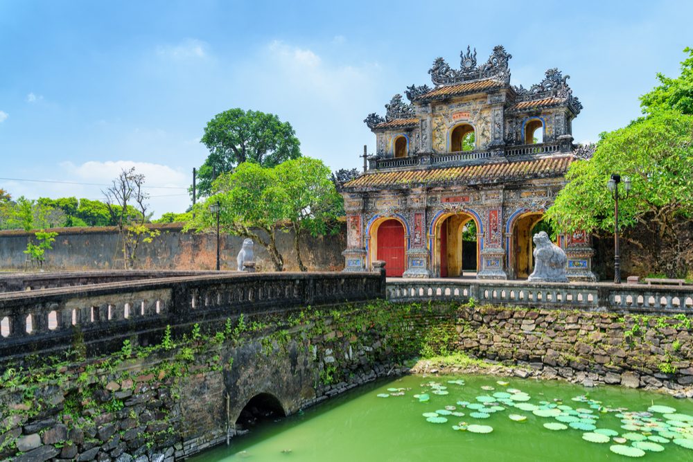 Wonderful view of the East Gate (Hien Nhon Gate) to the Citadel and a moat surrounding the Imperial City with the Purple Forbidden City in Hue, Vietnam. Hue is a popular tourist destination of Asia.